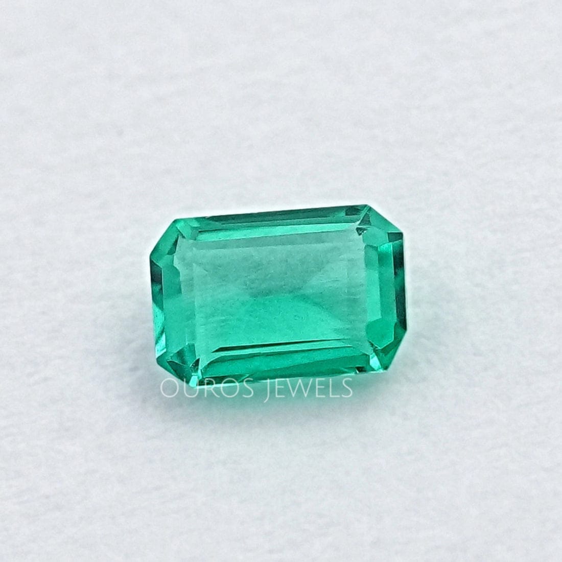 0.50 carat emerald-cut Colombian green gemstone showing classic step cut