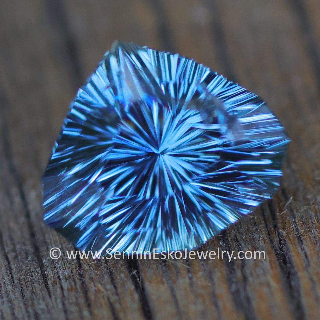 1.6 carat open blue sapphire with vivid royal blue color and triangle galaxy cut